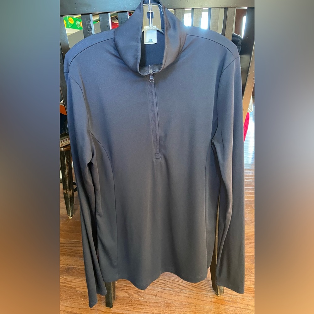 Sunshirt from Ocala - Ladies XS. Plain front and back. Embroidered on sleeve.